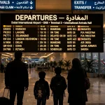 Pakistani family travelers at a Dubai airport departures board, September 2026 Dubai visit visa update