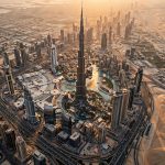 Aerial view of the Dubai skyline with the Burj Khalifa at golden hour