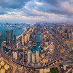 Aerial view of Dubai Marina with Palm Jumeirah in the distance