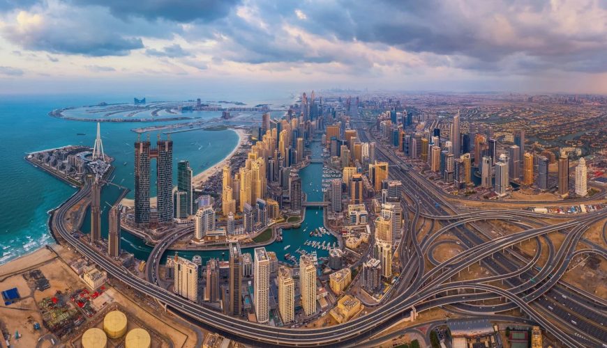 Aerial view of Dubai Marina with Palm Jumeirah in the distance