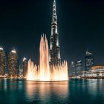 Burj Khalifa lit up at night behind the Dubai Fountain water show