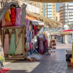 Busy Karama market street in Dubai with shops and shoppers