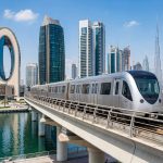 Dubai Metro Red Line train crossing the elevated track near Business Bay