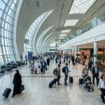 Travellers in the departures hall of Dubai International Airport