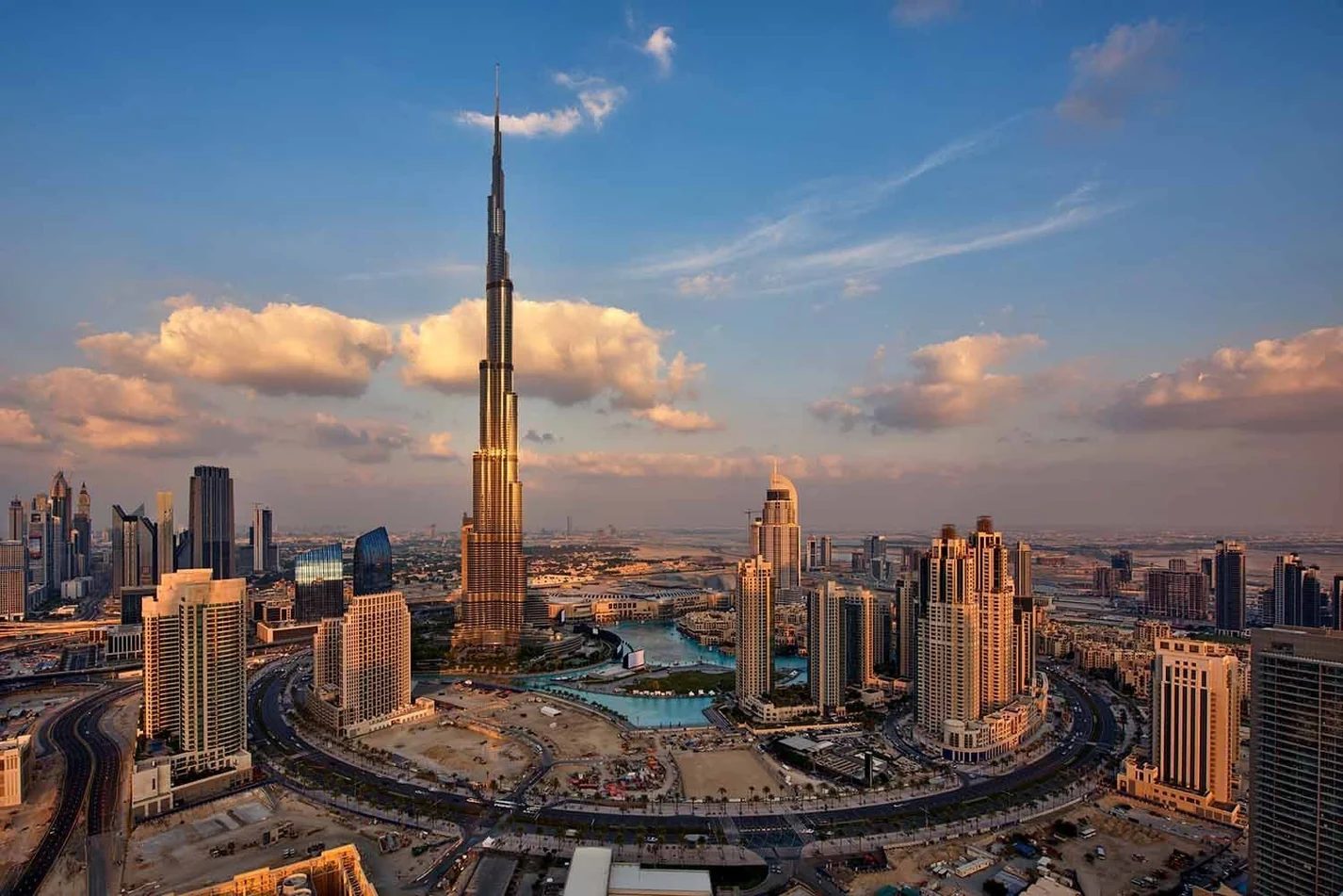 Aerial view of the Burj Khalifa and the Downtown Dubai skyline at sunset