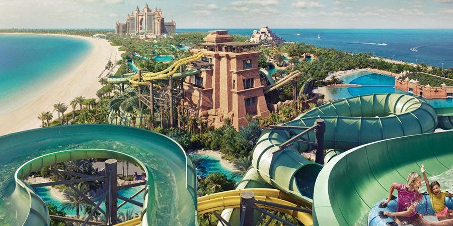 Family riding the slides at Aquaventure waterpark, Atlantis The Palm Dubai
