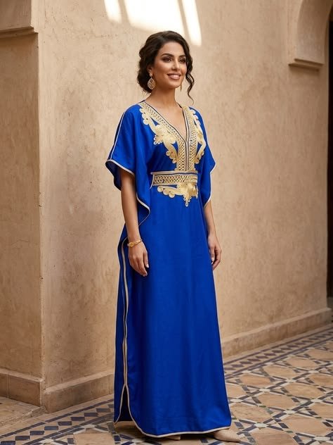Bright blue kaftan-style dress with gold neckline embroidery