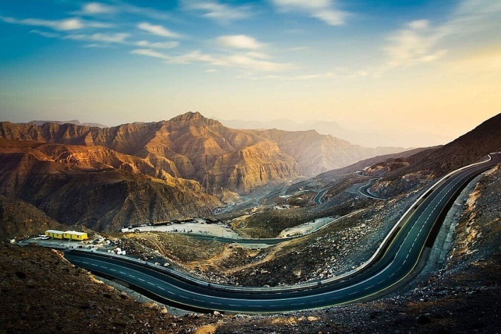 Mountain road winding through the rugged Hajar Mountains on the drive from Dubai to Hatta