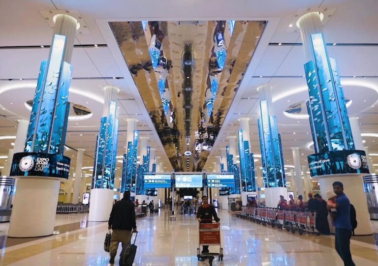 Travellers in the arrivals hall at Dubai International Airport Terminal 3