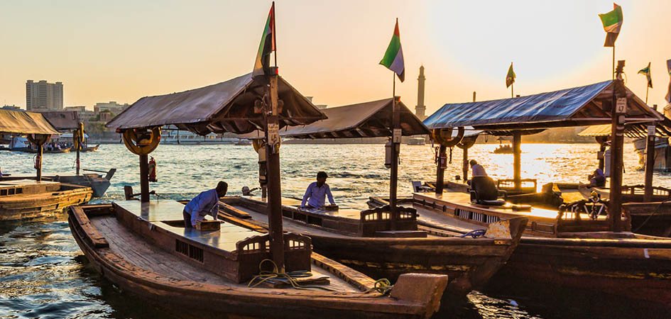 Traditional wooden abra boats crossing Dubai Creek