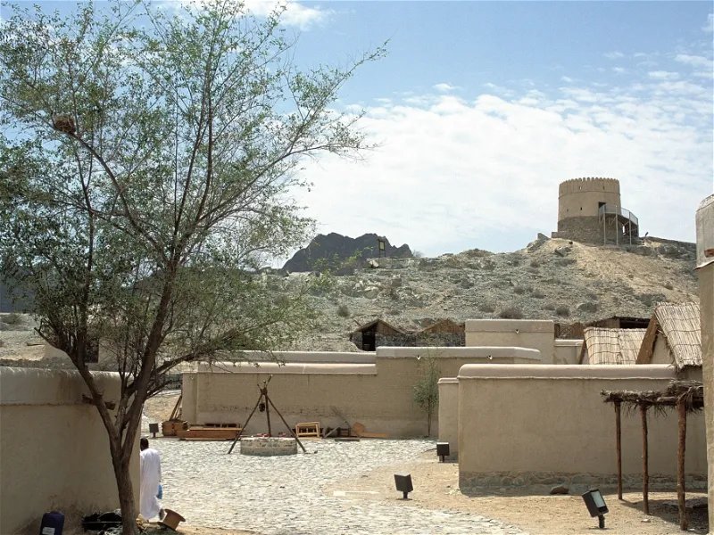 Stone watchtowers and restored buildings at Hatta Heritage Village
