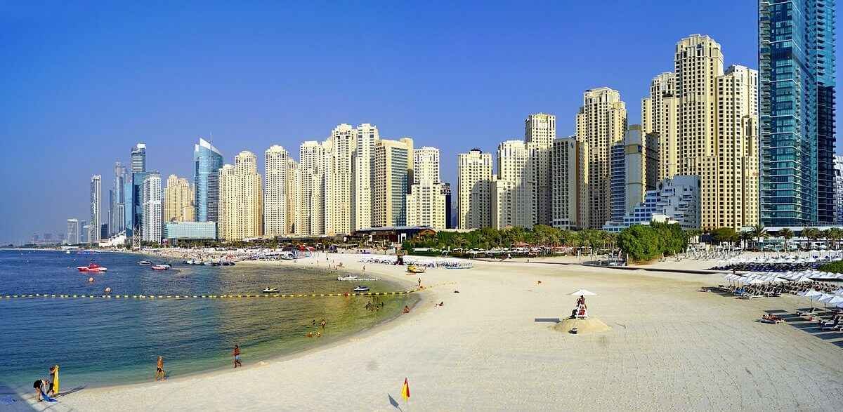 JBR beach with clear water and the Ain Dubai wheel in the distance