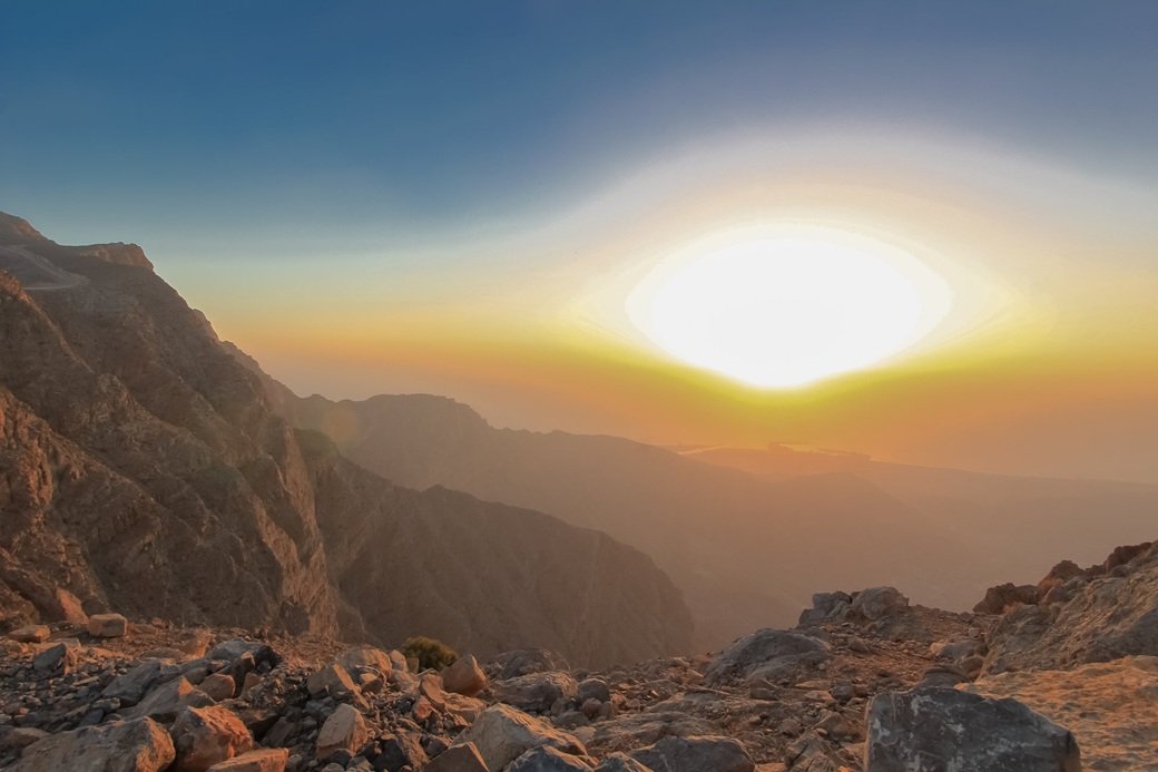 Sun setting over the Hajar Mountains near Hatta