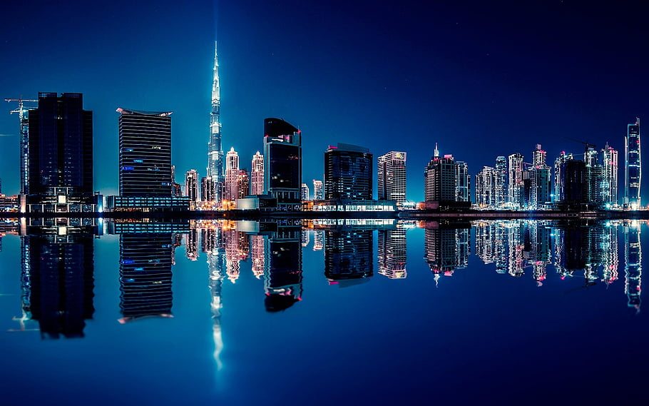 Dubai skyline at night with illuminated skyscrapers