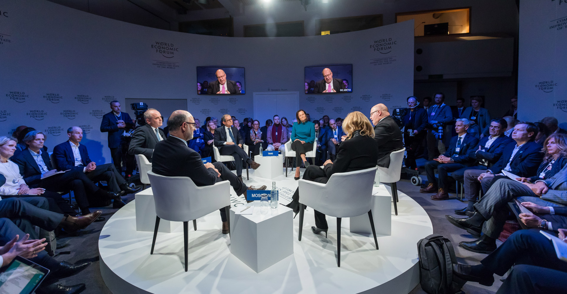 Panel discussion on stage at an international conference
