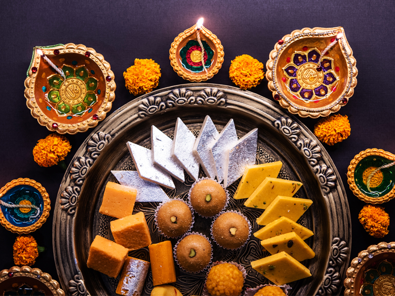 Diwali sweets and festive food served at a restaurant table