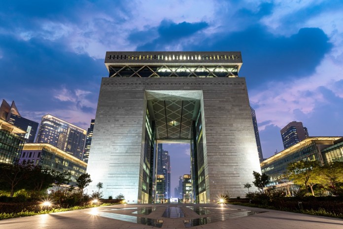 Dubai International Financial Centre gate building at dusk