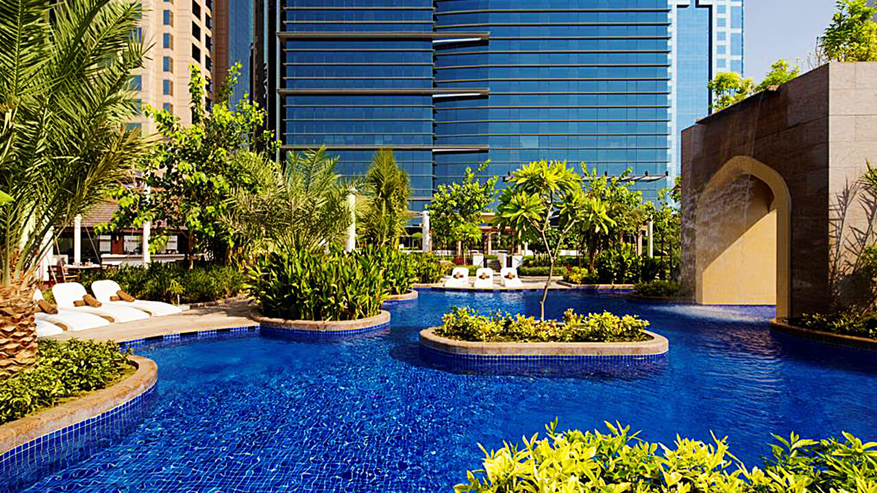 Conrad Dubai hotel tower and outdoor pool terrace on Sheikh Zayed Road
