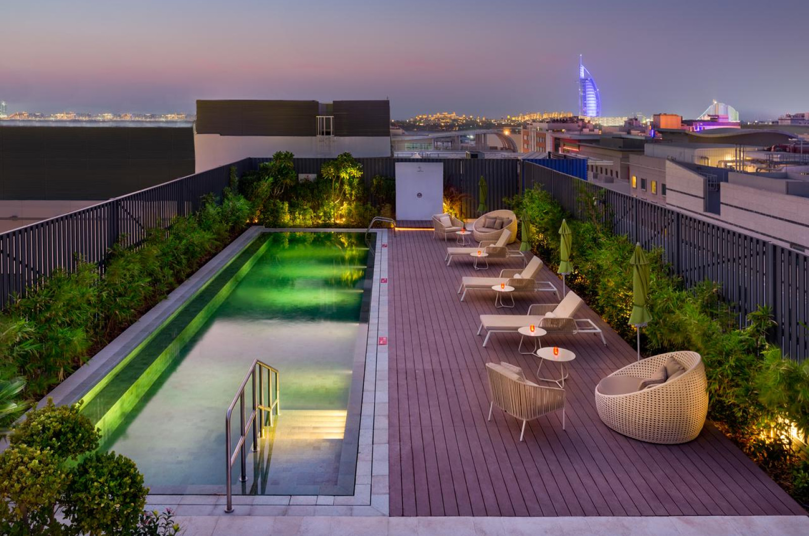 Millennium Al Barsha hotel pool deck with sun loungers in Al Barsha 1