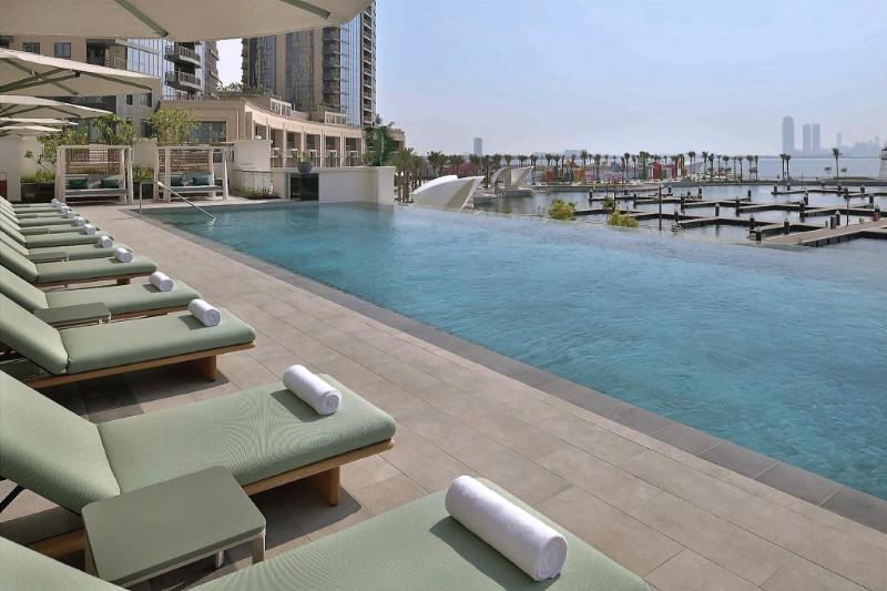 Vida Creek Harbour hotel and infinity pool on the marina promenade