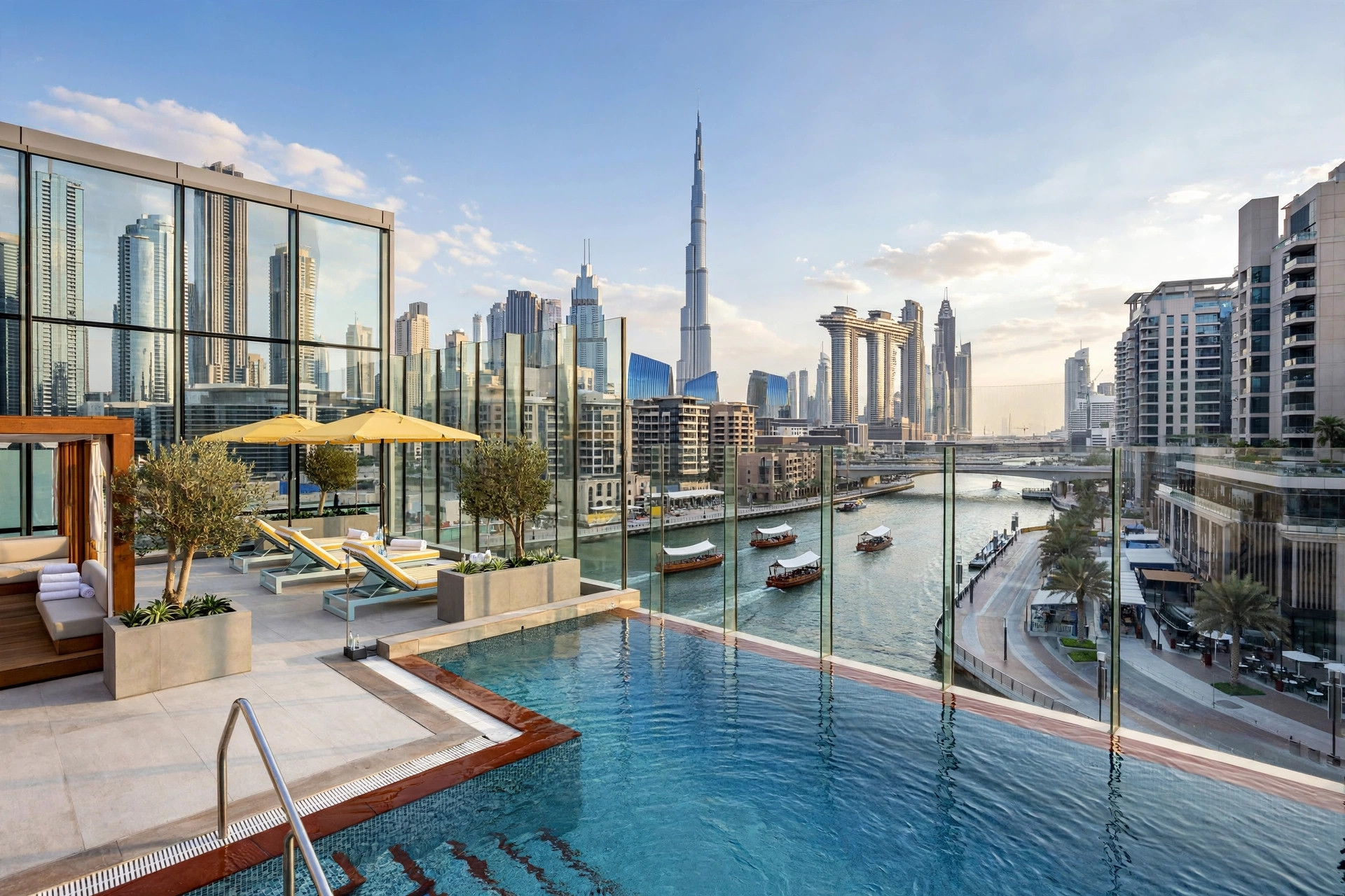 Glass-walled pool terrace at Pullman Dubai Downtown with Burj Khalifa in the background