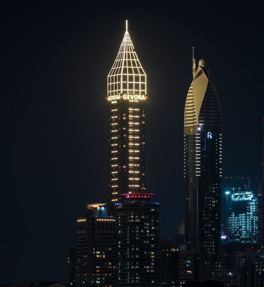 Gevora Hotel tall gold tower on Sheikh Zayed Road at night