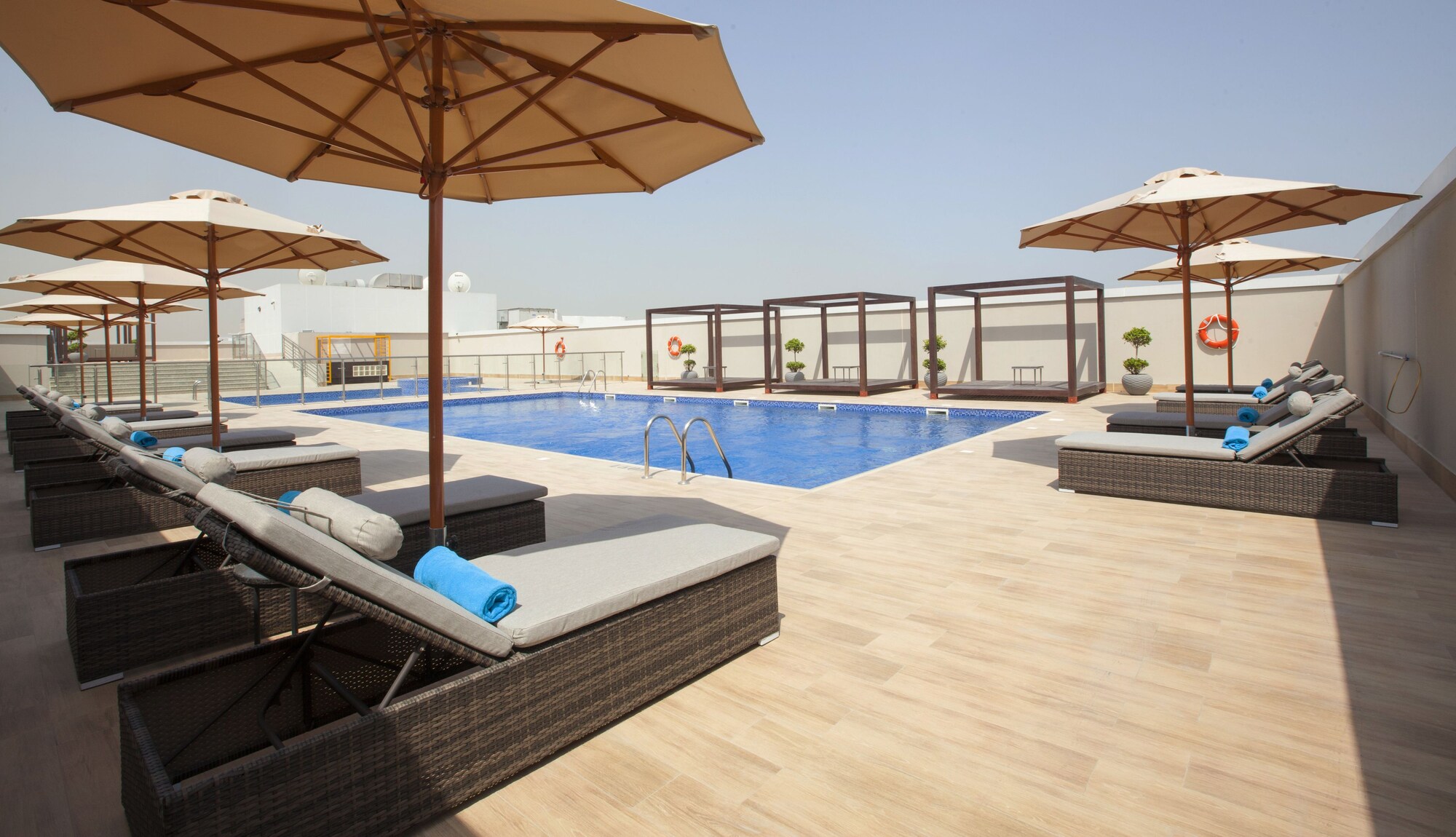 Flora Inn Hotel Dubai Airport pool deck in Al Garhoud