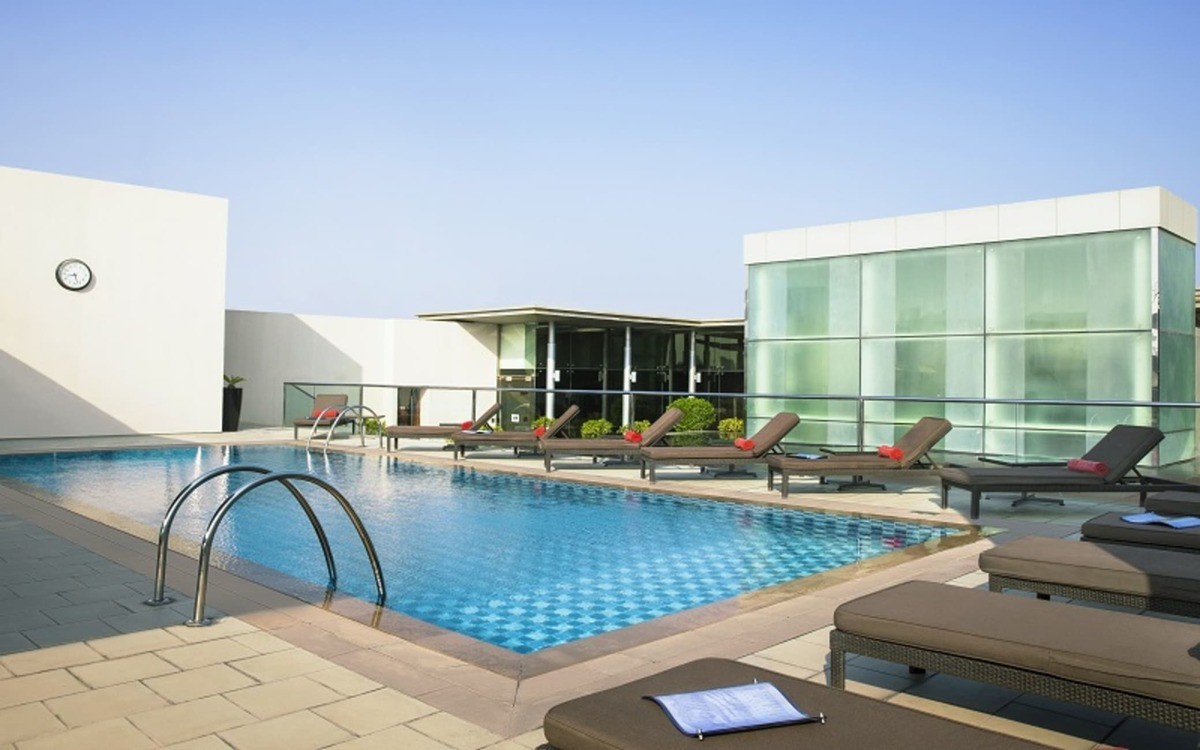 Rooftop pool and compact modern room at Centro Barsha by Rotana