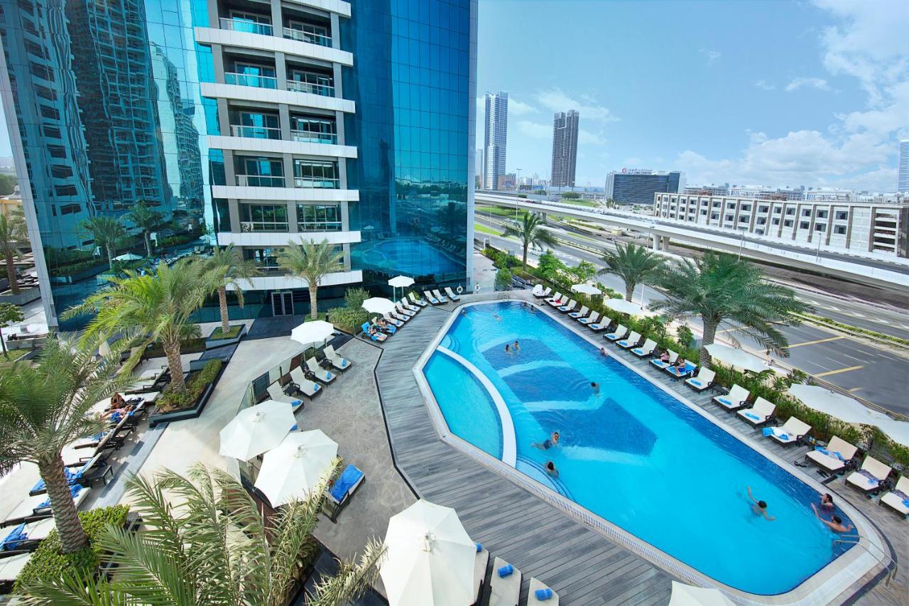 Atana Hotel Dubai facade and pool in Barsha Heights