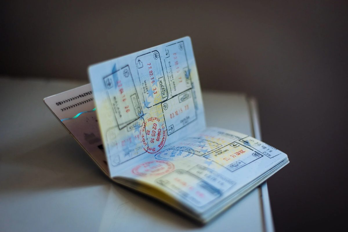 A passport and travel documents prepared for a visa application
