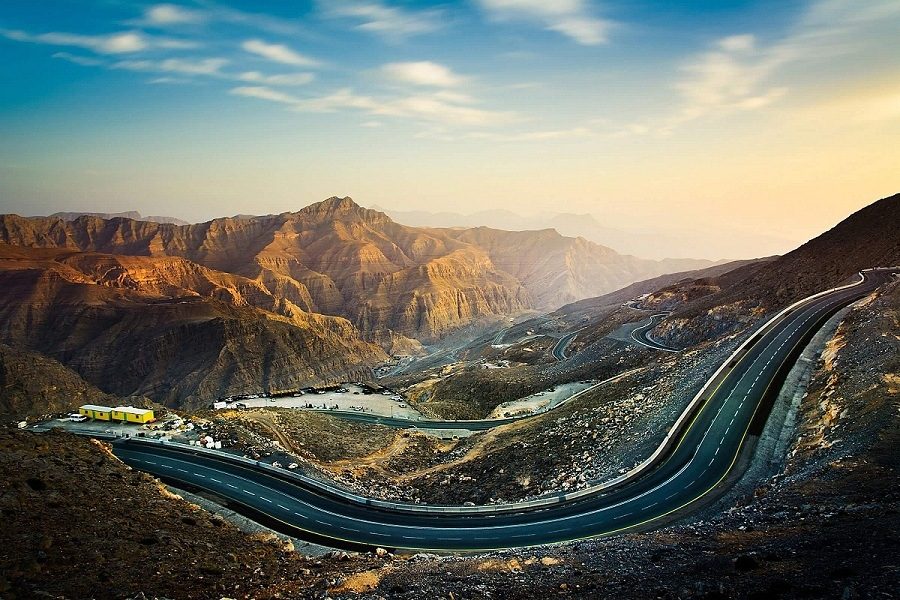 A highway road trip through desert scenery in the UAE