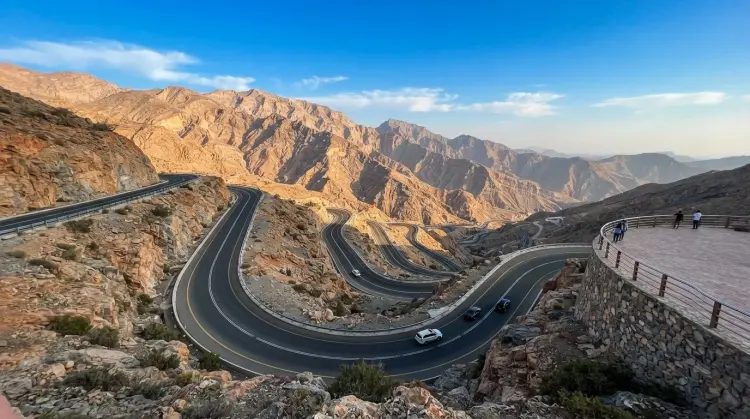 Road through desert and foothills towards the Hajar mountains