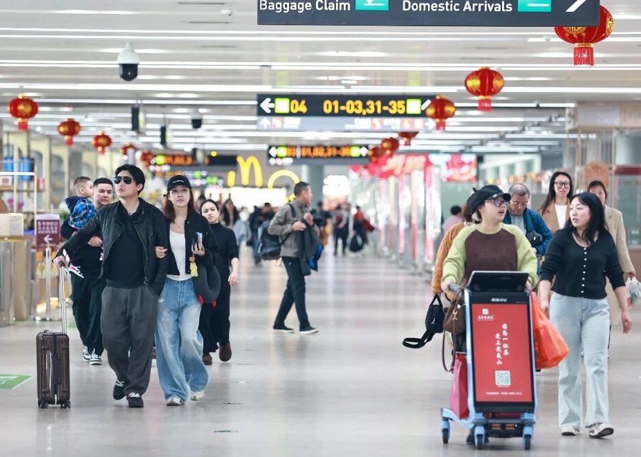 Passengers walking through an international airport arrivals hall