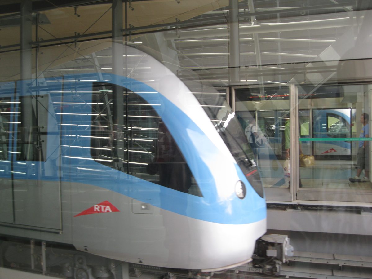 A Dubai Metro train arriving at a station platform