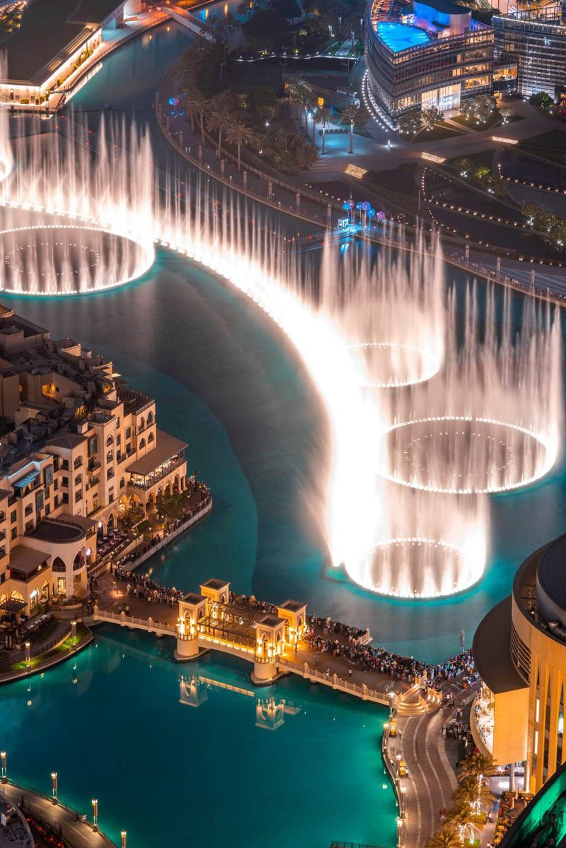 The Dubai Fountain performing at night on Burj Khalifa Lake, seen from above