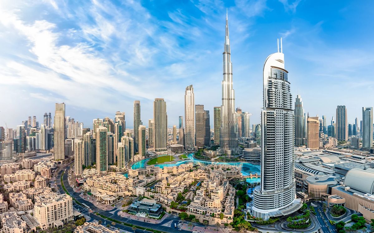 Tourists looking at the Dubai skyline during a sightseeing trip