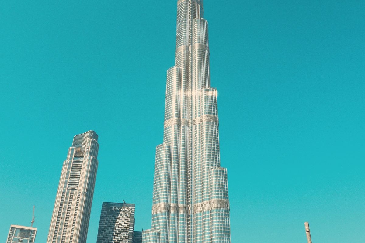 Modern Dubai skyscrapers against a clear sky