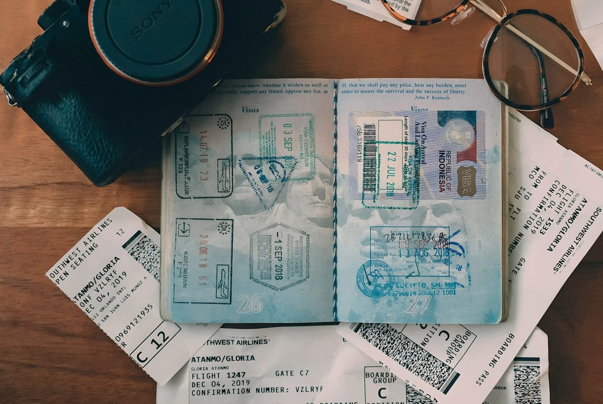 Passport and travel documents laid out for a visa application