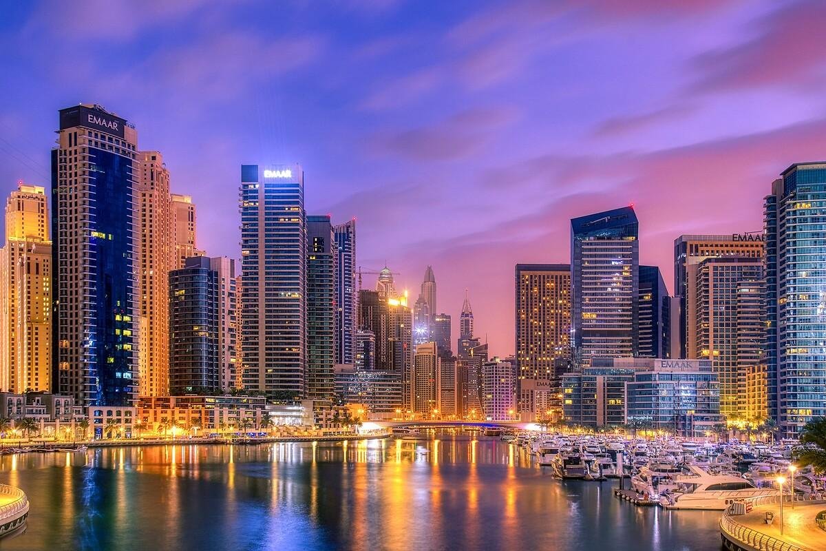 Dubai Marina towers and waterfront promenade in the evening