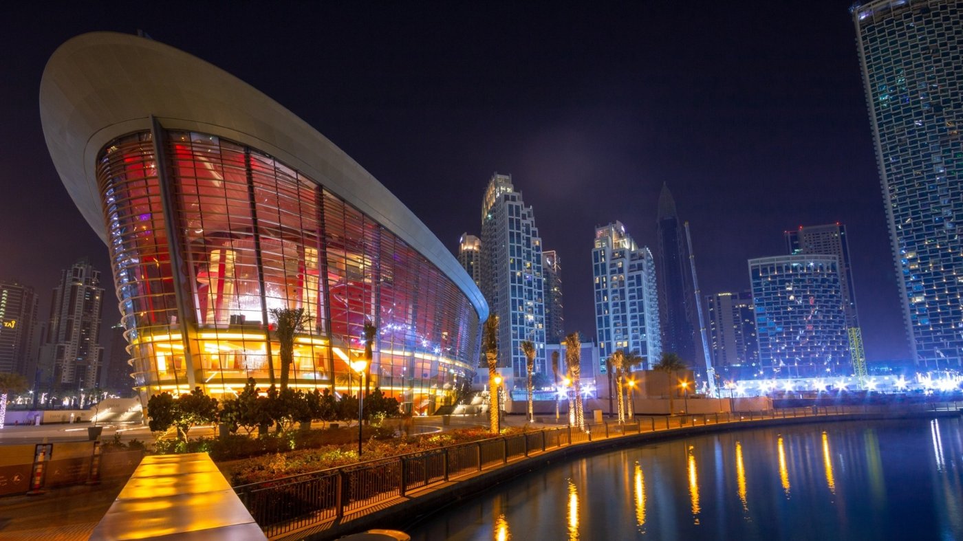 Dubai Opera dhow shaped building lit up at night Downtown