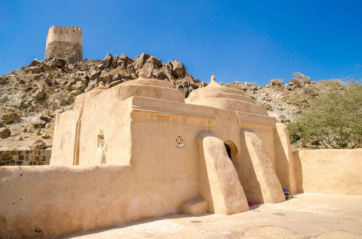 The small white domes of Al Bidya mosque, the oldest mosque in the UAE