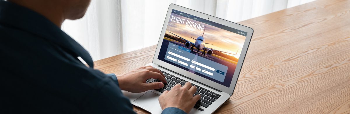 Traveller completing an online visa application on a laptop