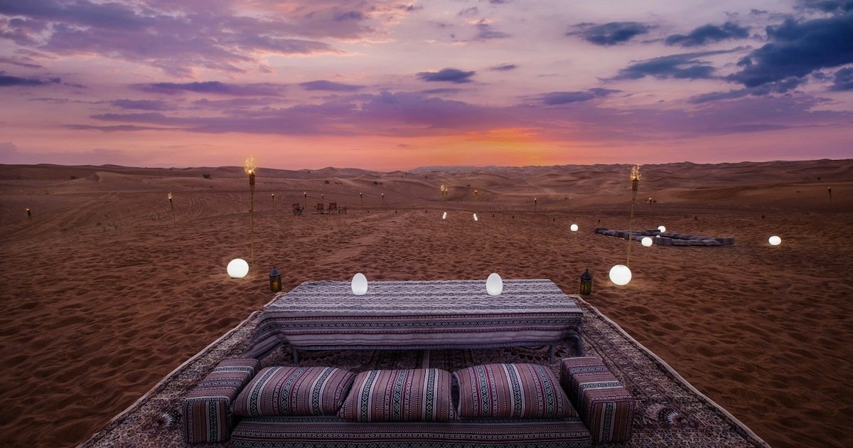 A desert camp at sunset near Al Qudra