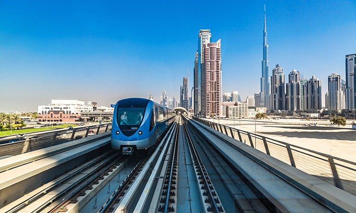 A Dubai Metro train passing through the city