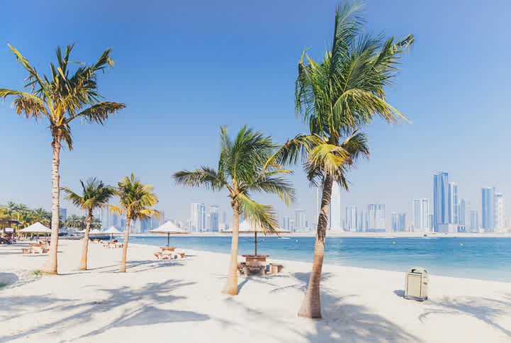 Calm lagoon beach and green park at Al Mamzar Dubai