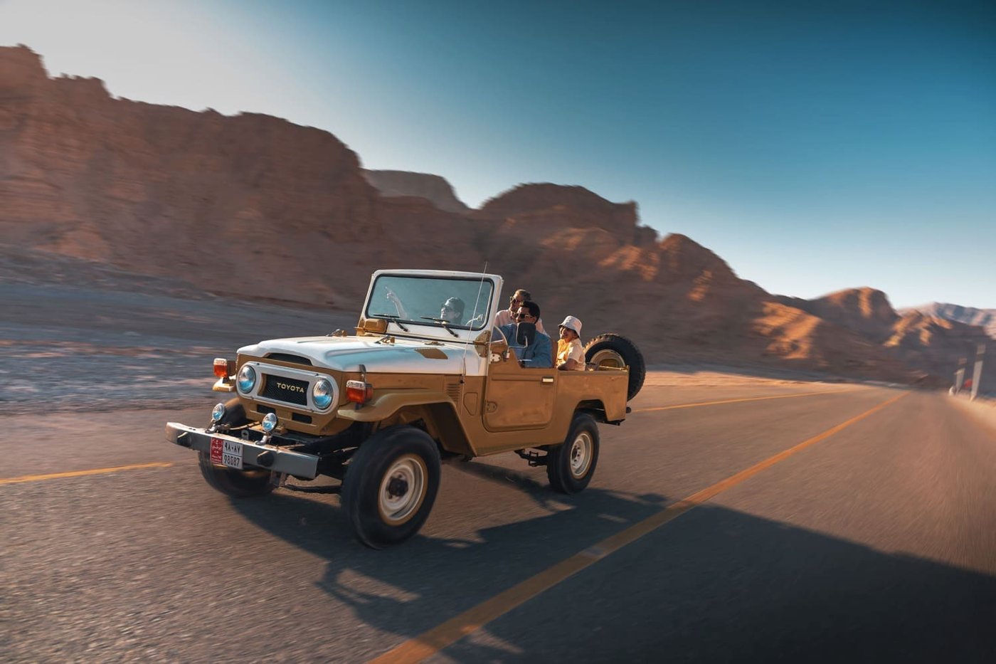 Family car parked at a mountain viewpoint in Ras Al Khaimah
