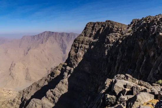 Sunrise light over the rocky peaks and valleys of the Hajar mountains at Jebel Jais