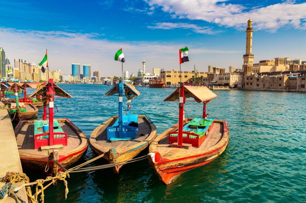 A traditional wooden dhow in a harbour in the UAE