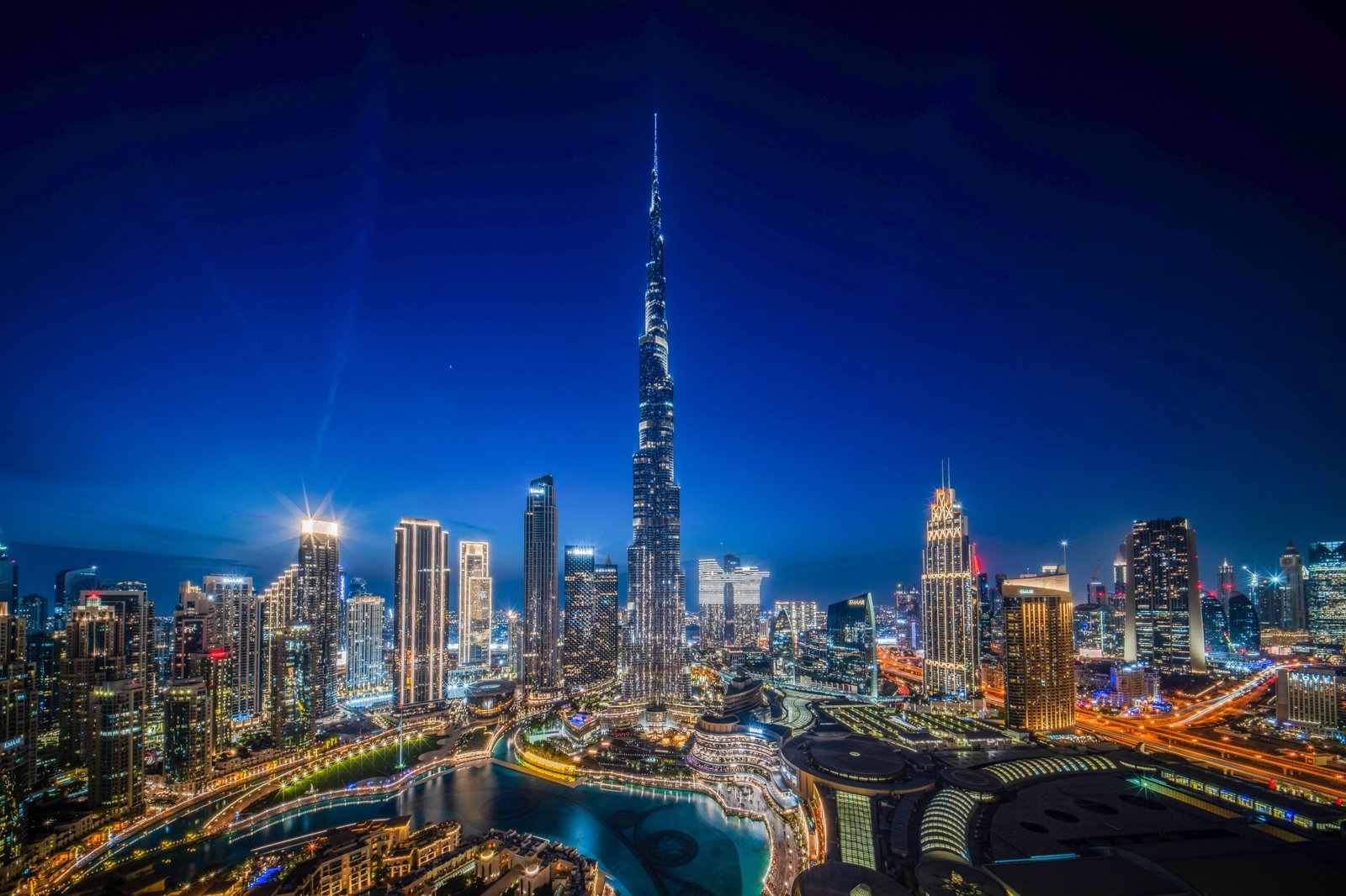 Burj Khalifa lit up at night over the city