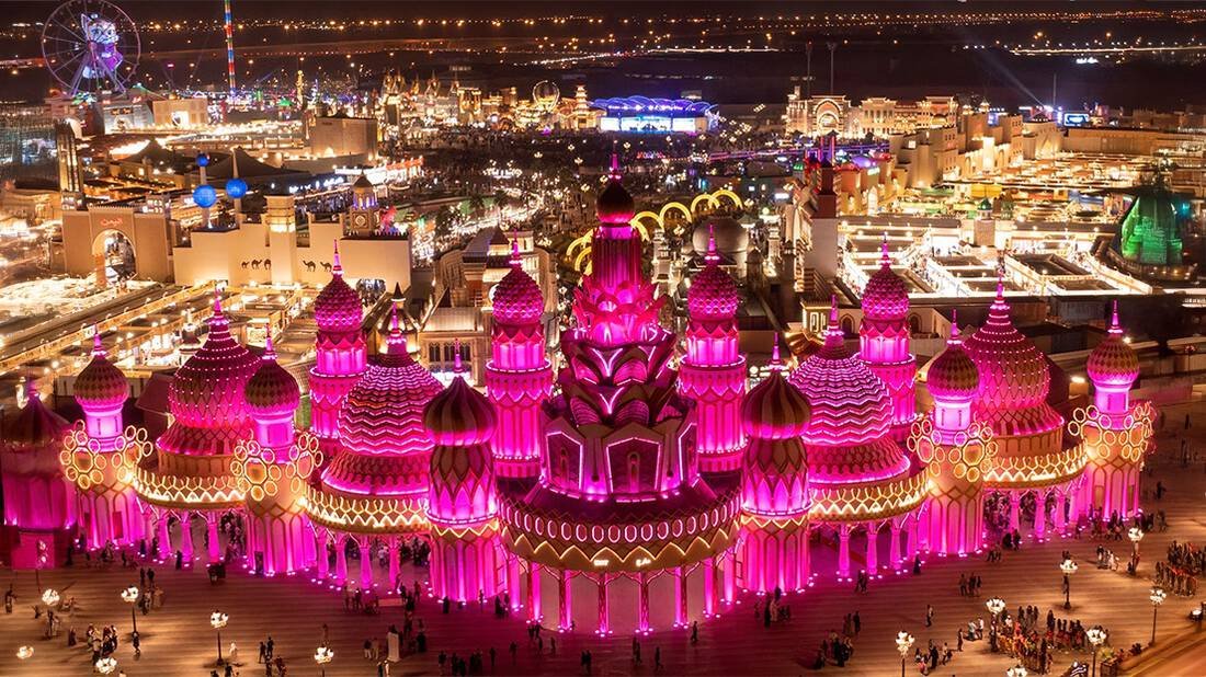 Global Village in Dubai lit up at night